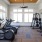 Gym with various equipment and natural lighting