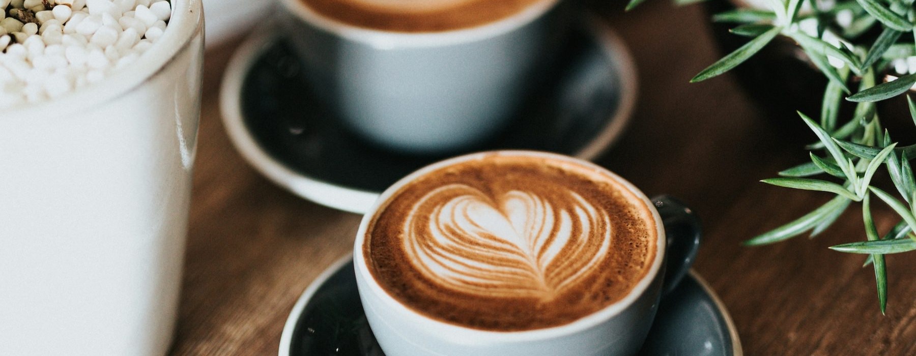 a couple of coffee cups on a table
