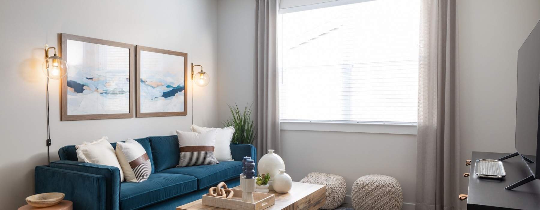 couch with modern decor in a well-lit living room