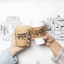 two hands holding coffee