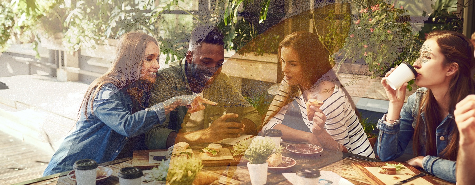 lifestyle image of friends eating outdoors